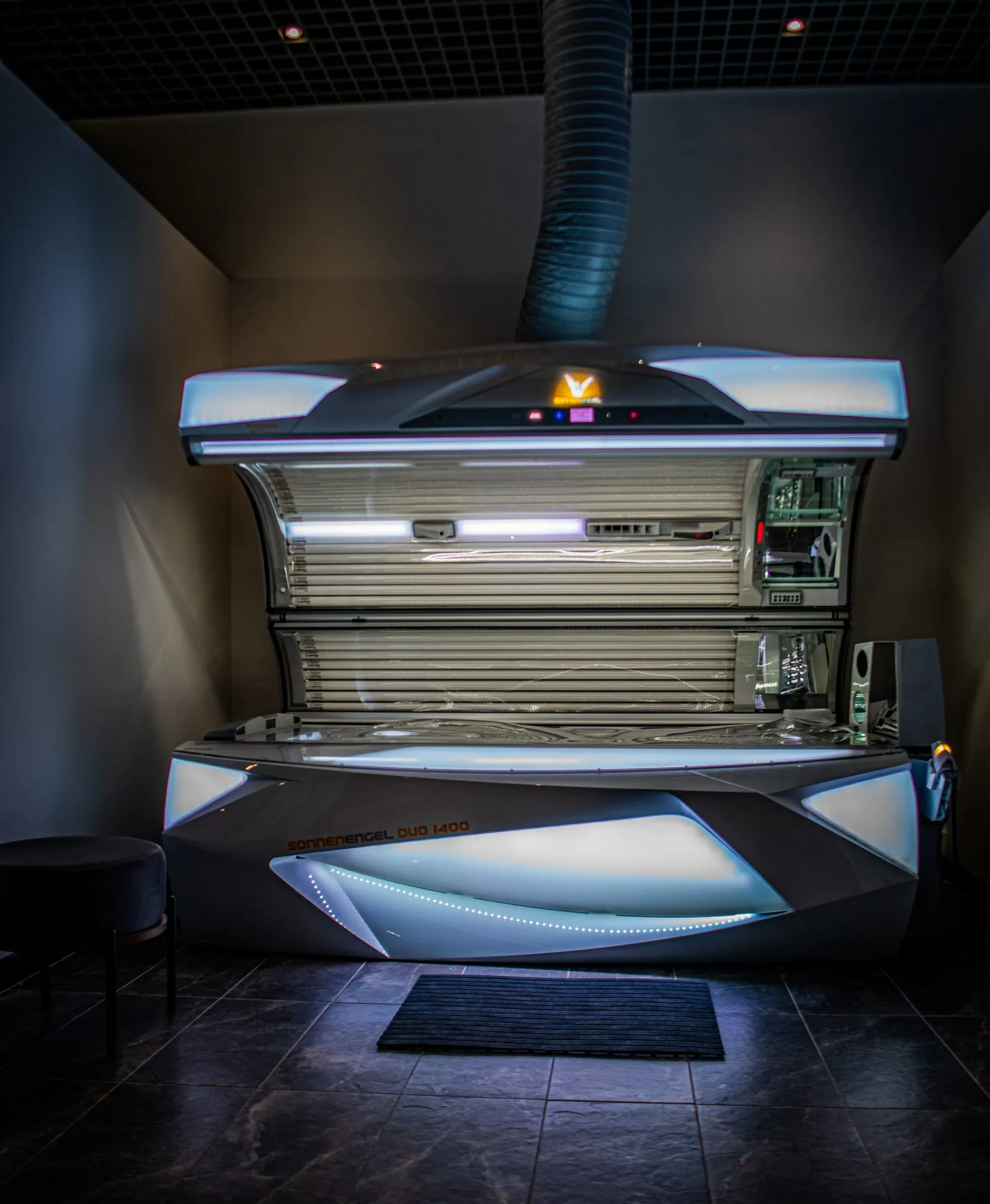 Sunbed with the canopy open in its cabin