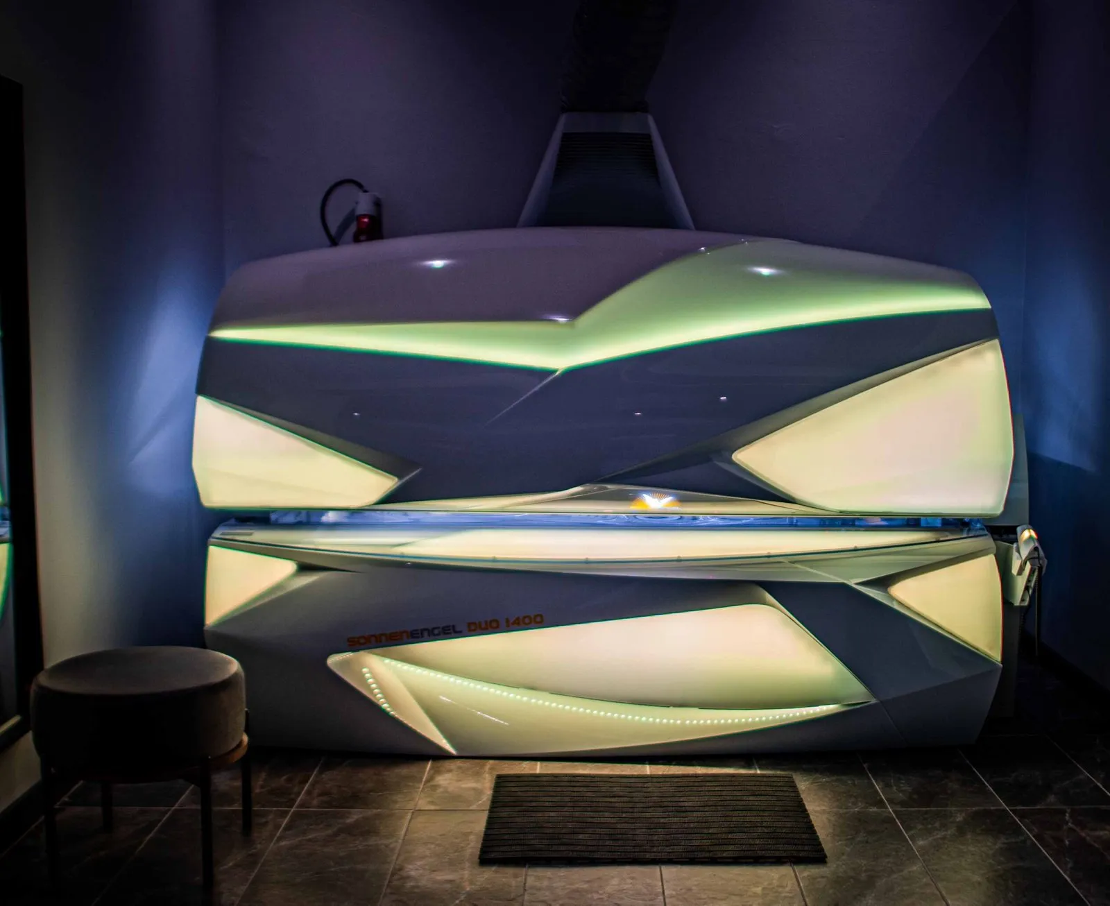 Lie-down sunbed with the canopy open